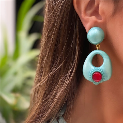 Torquize earrings with red stone